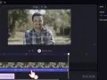 Edytor wideo Clipchamp. Panel audio z suwakiem głośności i opcją redukcji szumów (noise floor).